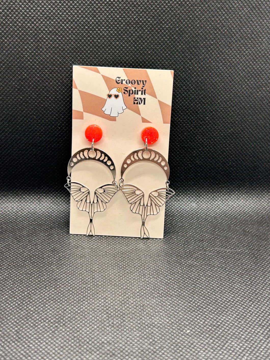 Silver moth and pink glitter stud earrings