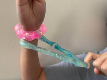 Load image into Gallery viewer, pink Feelzies™ Original Squishy Bracelet: Cotton Candy Sparkle fidget
