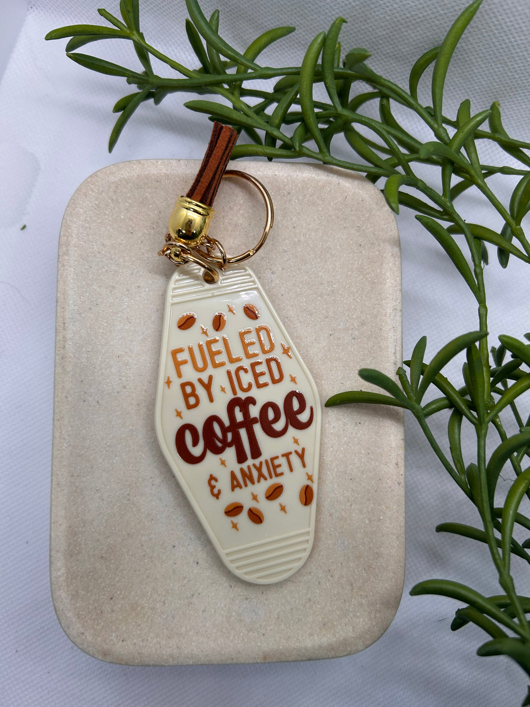 “Fueled by iced coffee and anxiety” motel style keychain
