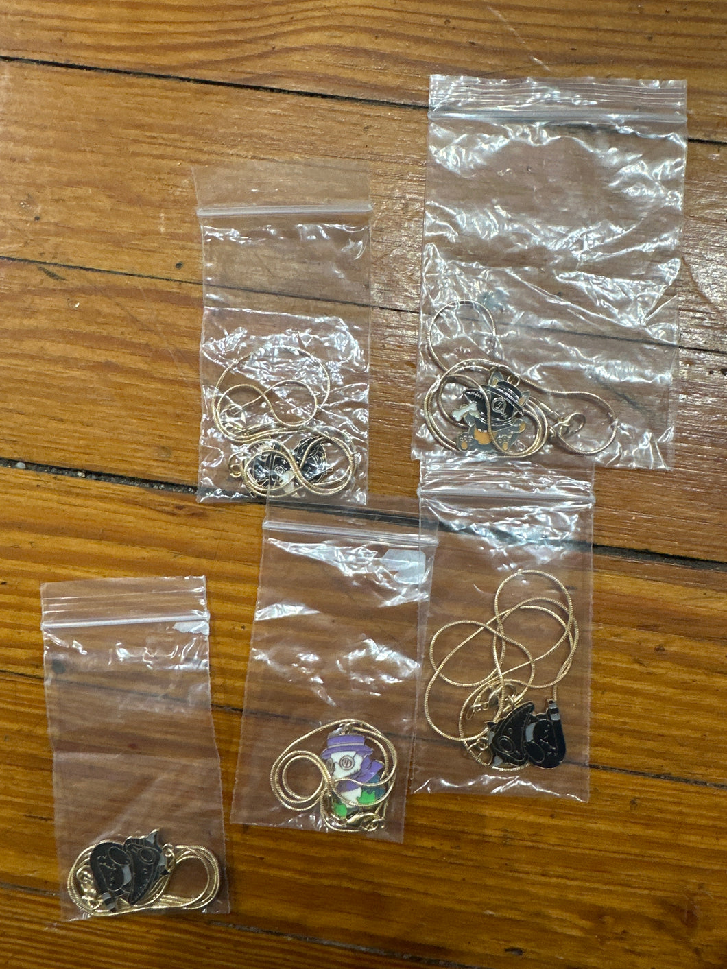 Various plague doctor necklaces